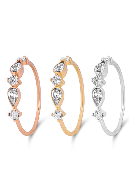 Anillo con diseño de piedras preciosas en forma de gota de oro macizo