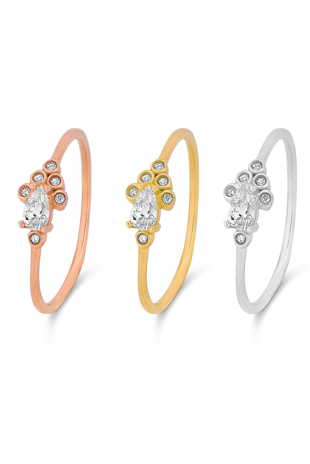 Anillo con diseño de piedras preciosas en forma de gota de oro macizo