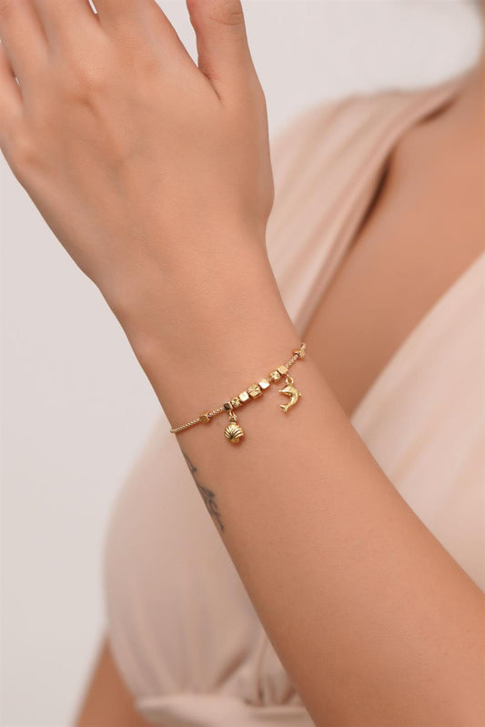 Pulsera con dijes tambaleantes de oro macizo