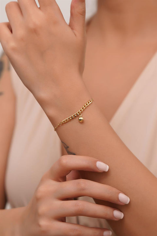 Pulsera de corazón tambaleante de oro macizo