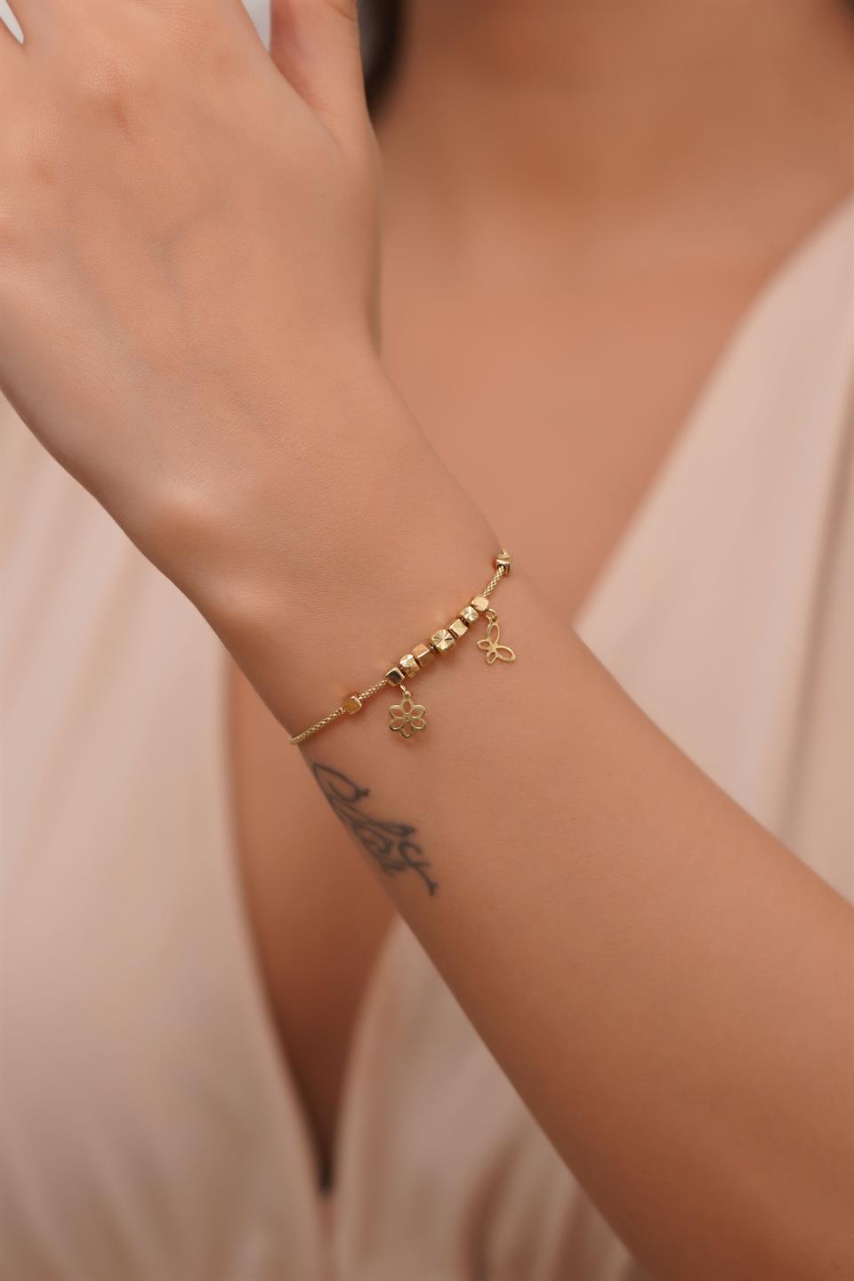 Pulsera con dije de mariposa tambaleante de oro macizo