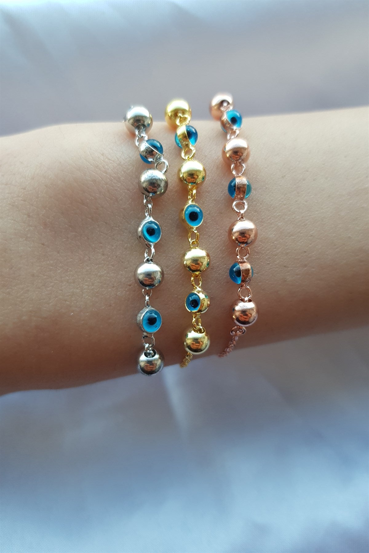 Pulsera de bolas de mal de ojo de plata