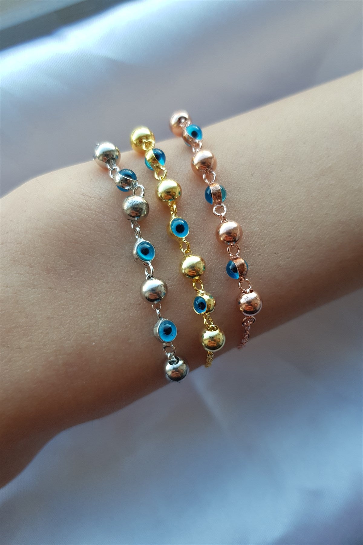 Pulsera de bolas de mal de ojo de plata