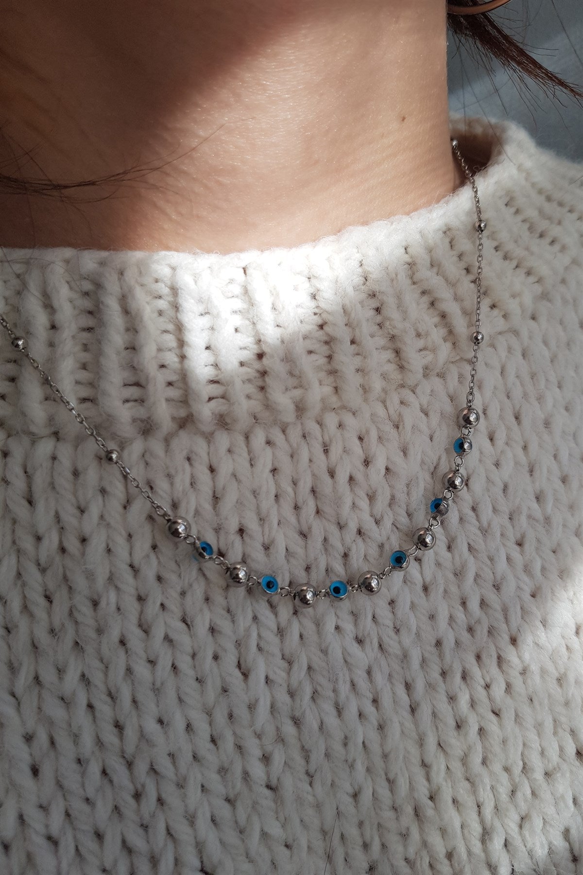 Collier boule en argent contre le mauvais œil