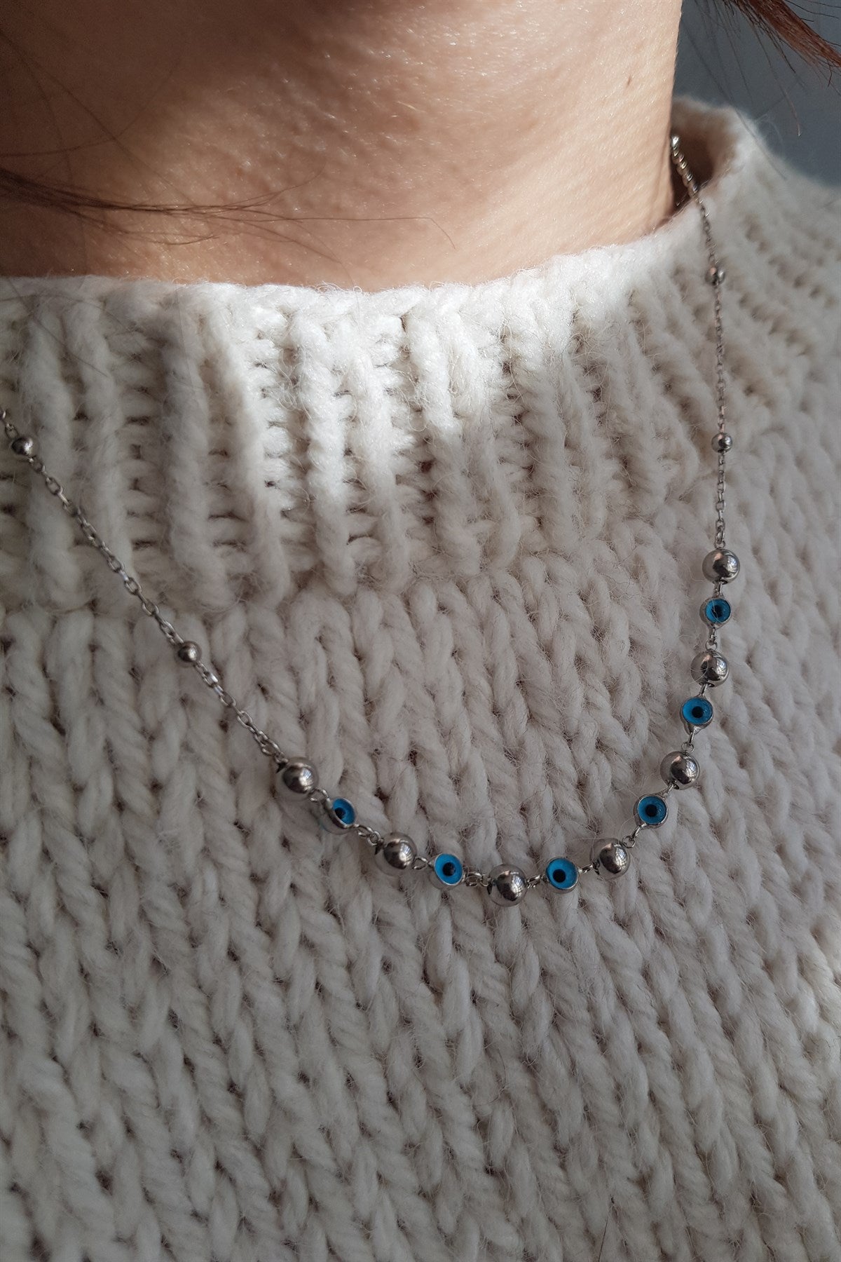 Collier boule en argent contre le mauvais œil